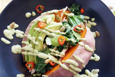 Loaded Sweet Potato with cilantro lime sauce, kale, chicken, avocado